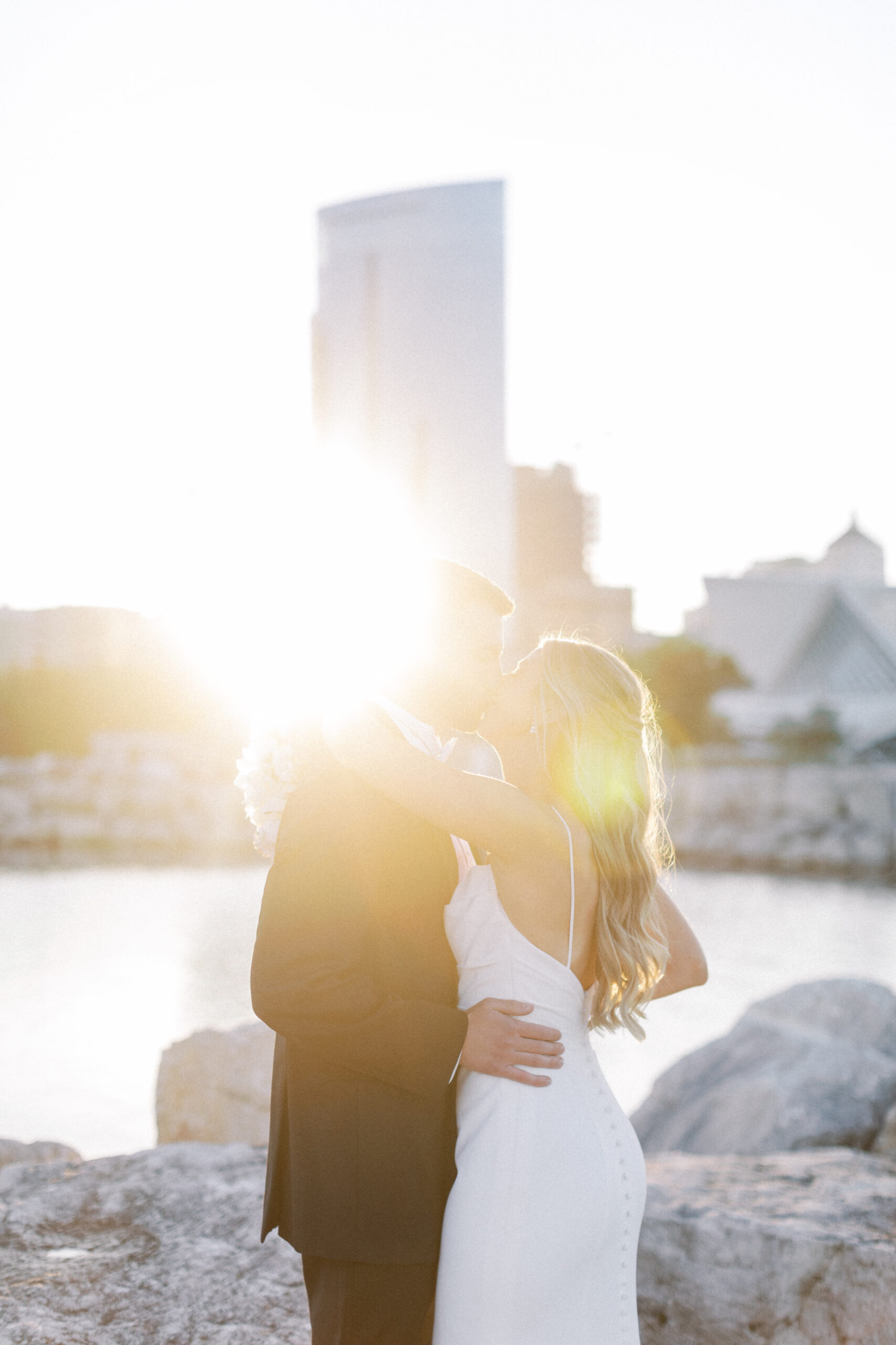 Photo of bride and groom at sunset in Milwaukee on Lake Michigan's lakefront